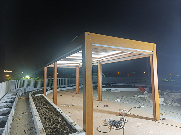 4x6 wood grain bioclimatic aluminum pergola night lighting view in Spain urban park