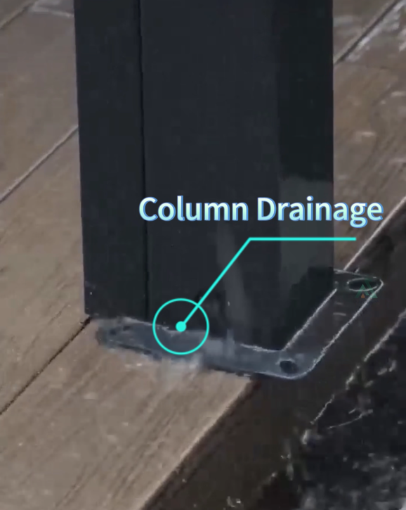 Aluminum louvered pergola post base showing integrated internal column drainage system discharging rainwater onto decking